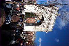 People marching in a city with signs demanding justice for victims of police violence