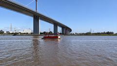 Westgate Punt boat under West Gate Bridge in Melbourne