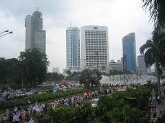 Bundaran Hotel Indonesia Jakarta at twilight with bustling traffic