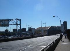 old and new bridge with traffic on the new bridge with empty old bridge to the right on opening day