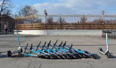 Bird brand electric scooters artistically stacked in front of Äußeres Burgtor in Vienna