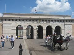 Burgtor gate in Vienna with statues and flag