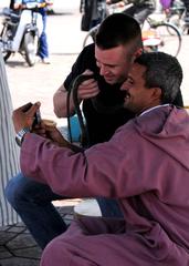 First Lt. Adam Gregory with snake charmer at Jemaa el Fna market in Marrakech