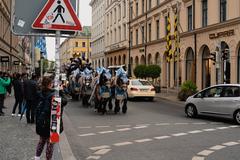 Horse-drawn carriage with beer barrels and people at Odeonsplatz in Munich