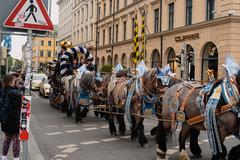 horse-drawn carriage carrying beer barrels and people at Odeonsplatz in Munich