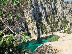 view of Parc national des Calanques with clear blue sea and rugged cliffs