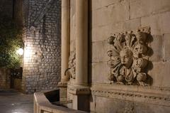 embedded faces in a fountain at the entrance of the Old City of Dubrovnik, Croatia