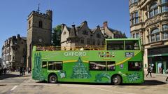 City Sightseeing Oxford bus at Carfax turning from St Aldate's into High Street