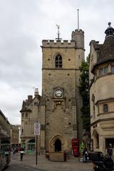 Historic quadrangle at Oxford University filled with tourists on a bright day