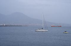 Boat and Mount Vesuvius in the gulf of Naples