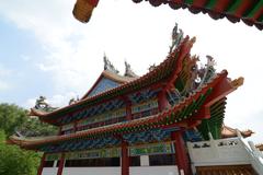 Thean Hou Temple's front entrance with multi-arched gateway and red pillars on Robson Hill