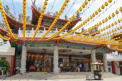 Thean Hou Temple in Kuala Lumpur featuring multi-arched gateway with red pillars