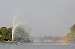 rainbow over Hamburg Binnenalster lake with Alster fountain