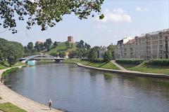 Neris River with Gediminas Hill and Tower in the background in Vilnius