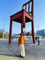 Man in traditional Tamil Indian costume standing in Geneva, Switzerland