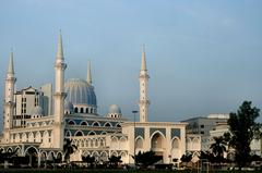 Kuantan city skyline with buildings and lush greenery under a blue sky