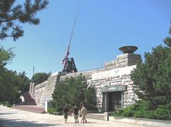 large metronome on a hill with a red pendulum in Prague