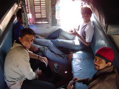 Group of people playing cards indoors