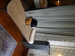 vanity cabinet with a divan and a radiator leading to the bedroom on the left