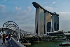 Helix Bridge and Marina Bay Sands in Singapore at dusk