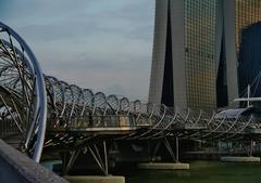 Helix Bridge in Singapore at dusk with city skyline