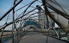 Helix Bridge illuminated at night in Singapore