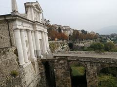 Porta San Giacomo in Bergamo under a clear blue sky