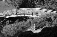 Black and white photo of an arched bridge in Toronto Botanical Gardens