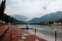 Ganges river in Rishikesh with mountains in the background