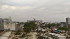 This pic is taken from top of the building. This shows buildings replaces the field where farmers cultivated .This picture is of noida region.