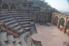 Aerial view of an amphitheater with seating and a central stage