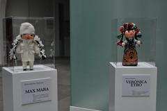 Traditional Mexican rag dolls dressed to mimic designers Max Mara and Verónica Etro