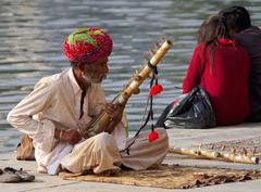 street musician on the bank of Pichola Lake in Udaipur