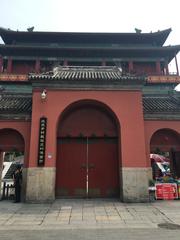 The Drum Tower in Beijing showing its traditional architectural style against a clear sky