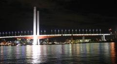 Bolte Bridge at night with Melbourne CBD and Telstra Dome