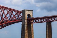 Forth Bridge spanning across the Firth of Forth in Scotland