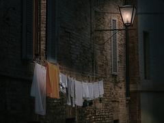 Freshly washed clothes hanging to dry in Siena, Italy