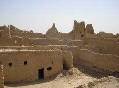 Historic buildings and palm trees in Dir'iyyah, Saudi Arabia