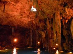 Cenote Dzitnup inside view with a hole in the ceiling