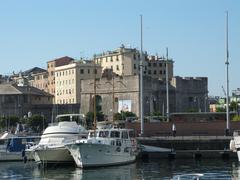 view of the ancient port of Genoa with boats and buildings