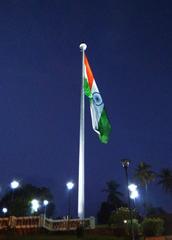 Kanakakkunnu National Flag pole against a clear blue sky