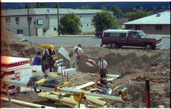 House construction site with workers in Invermere, British Columbia