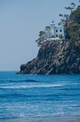 Portofino lighthouse on a rocky cliff