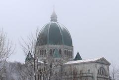 Saint Joseph's Oratory dome in mist after first November snow