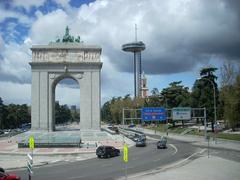 Arco de la Victoria and Faro de Madrid with the Museum of the Americas tower in the background