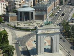 Arco de la Victoria in Madrid with distant view of Junta Municipal del Distrito de Moncloa - Aravaca