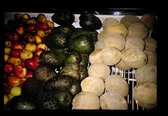 Cherimoya fruit held by person