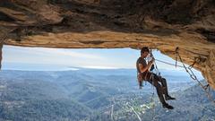 Aid climber on the roof of Le grand toit, Baou de Saint-Jeannet, France