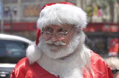 Man dressed as Santa Claus walking around Santiago