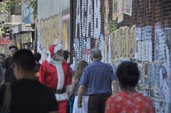 Man dressed as Santa Claus walks around Santiago